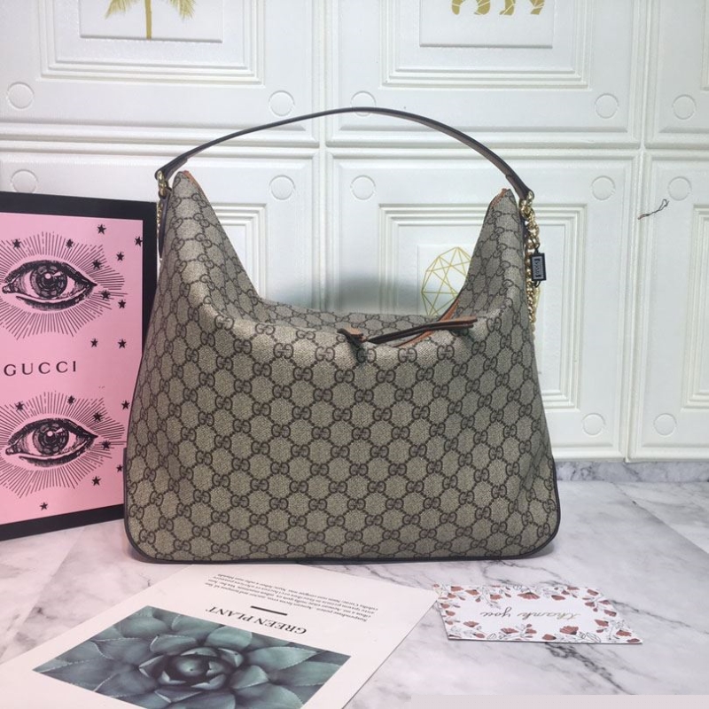 G*u*i top handle bags